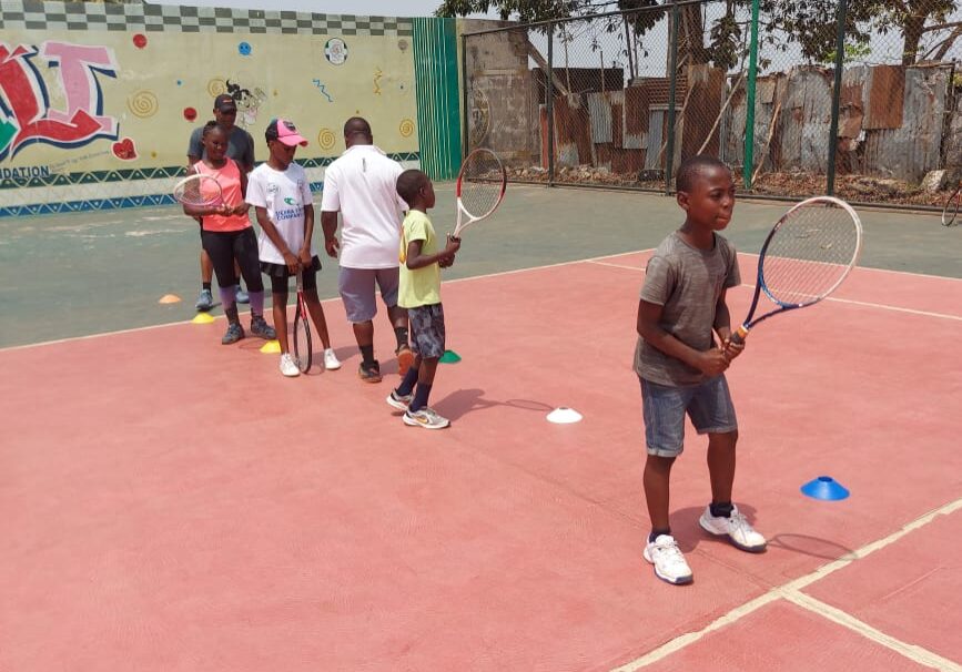 Young players practising on the Hill Station tennis court
